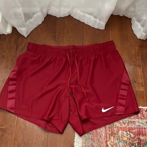 Nike red athletic shorts size medium